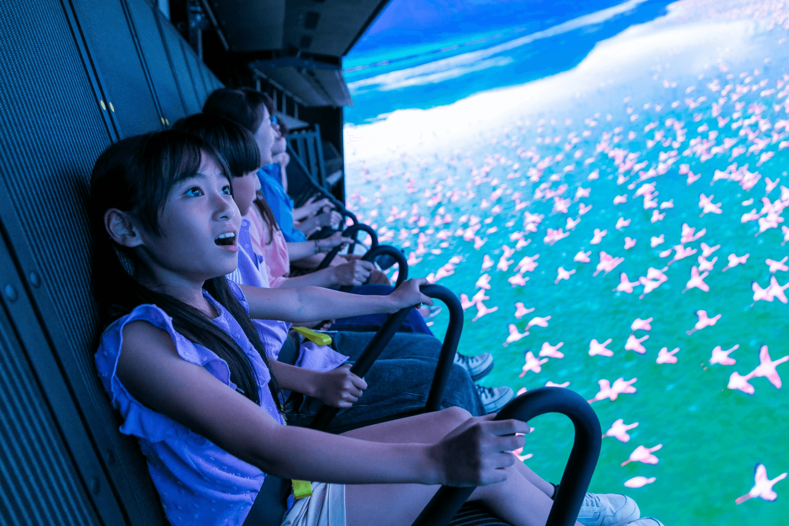 Guests enjoying a flying theater experience