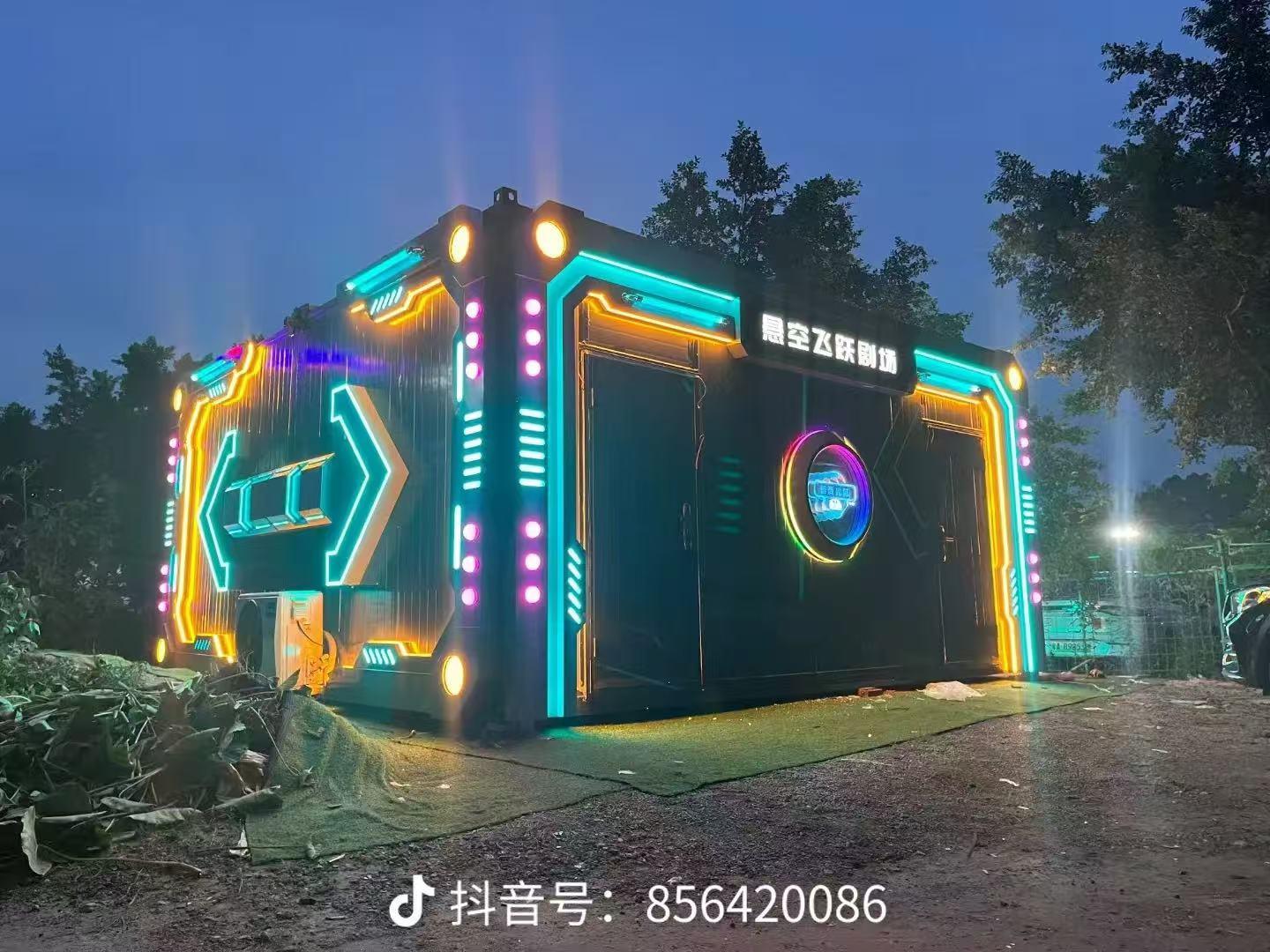Outdoor Container Flying Theater illuminated at night