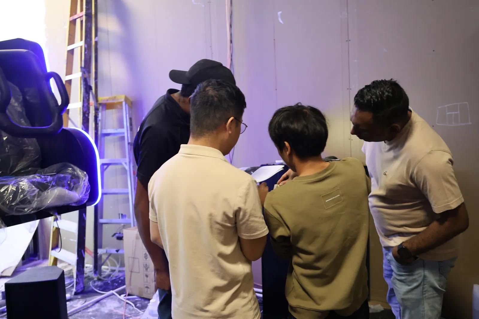 Project team reviewing a flying theater installation site